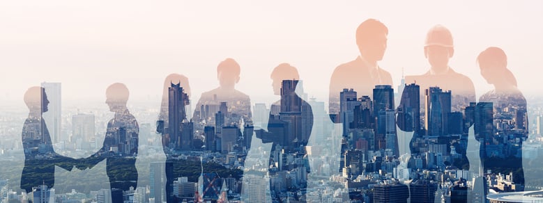 blurred people in front of a city background