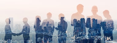 blurred people in front of a city background