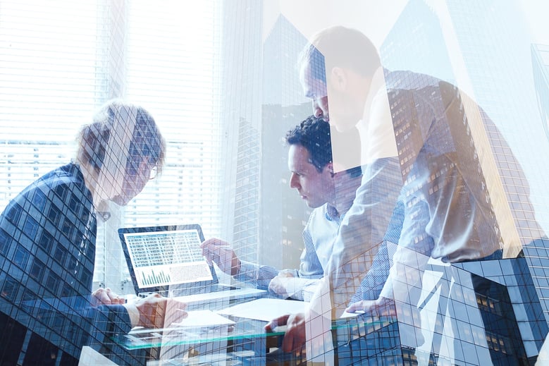 coworkers discussing something on a screen