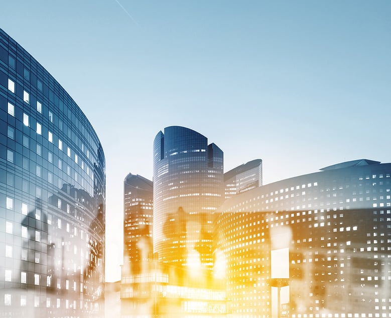 blurred office workers walking in a downtown setting