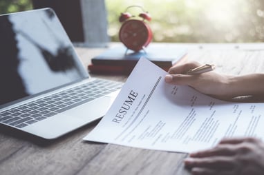 person holding a resume