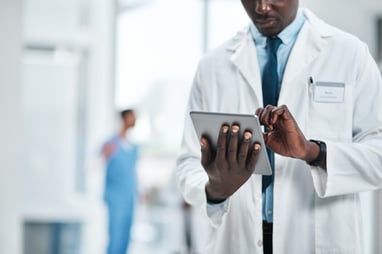 physician entering patient information into portal