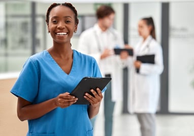 healthcare technologist holding a device