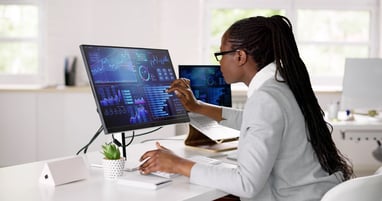 data engineer navigating a computer dashboard