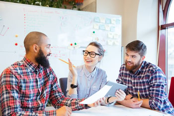 Multiethnic group of happy business people working together in office