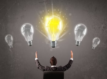 Business person having an bright idea light bulb concept