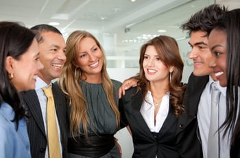 Group of business people smiling together in an office
