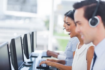 Line of agents working on computers in a call centre