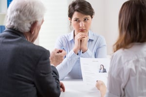 Woman during difficult job interview at a corporation