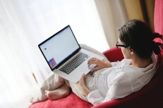 happy young woman relax at home on sofa-1