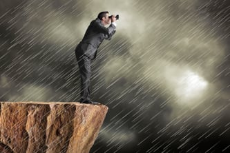 Businessman Looking Through Storm