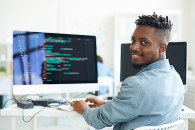 developer coding on a desktop