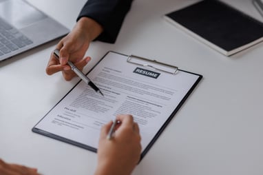hiring manager reading a resume