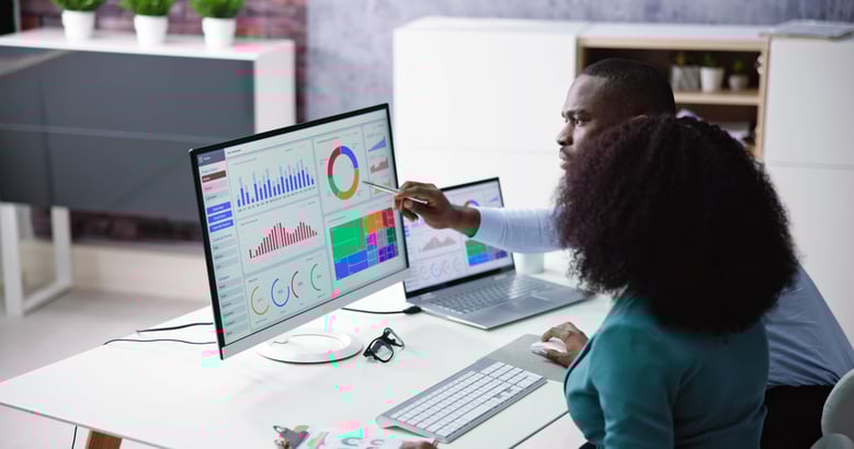 data professionals examining a dashboard