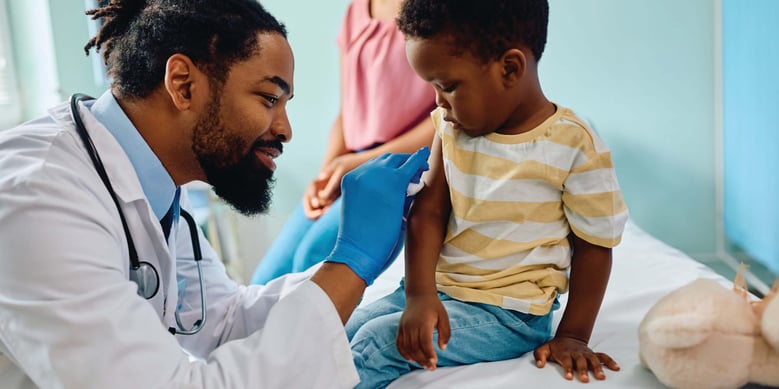 Child receiving vaccination in a healthcare setting