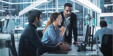 Team of Three Software Developers Discuss an AI Project