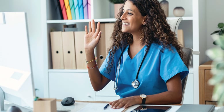 Nurse or healthcare professional working remotely with stethoscope around neck.