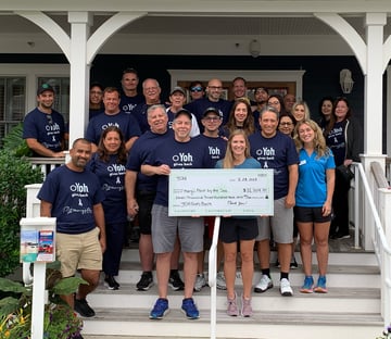 Marys Place Yoh Gives Back 8_2023 group on porch with check