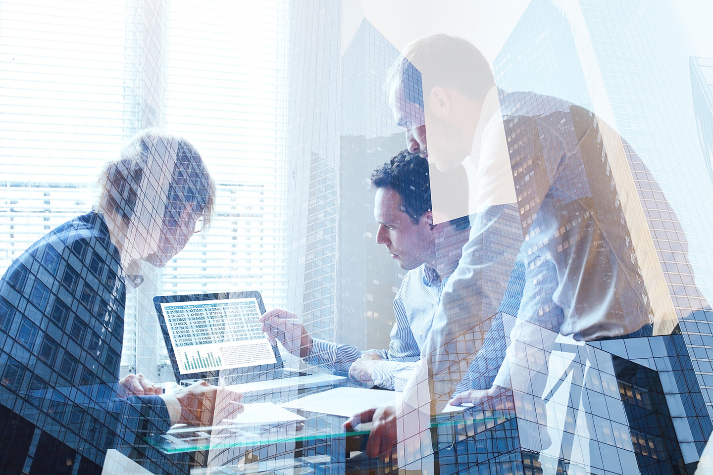 coworkers discussing something on a screen