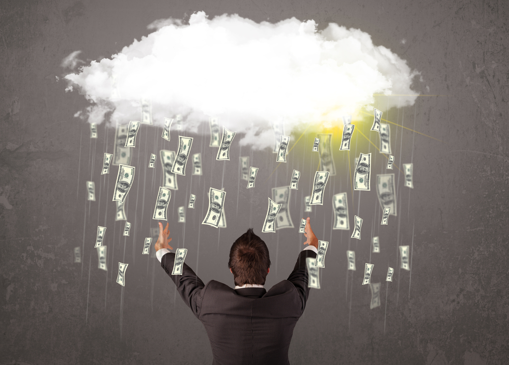 Business man in suit looking at cloud with falling money and sun-1
