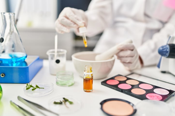 chemist working with cosmetics