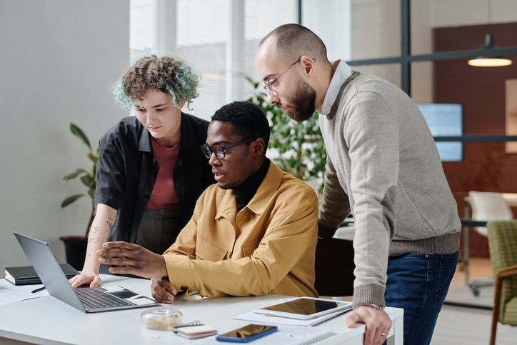 Office Workers Working in Team on Business Project on Computer
