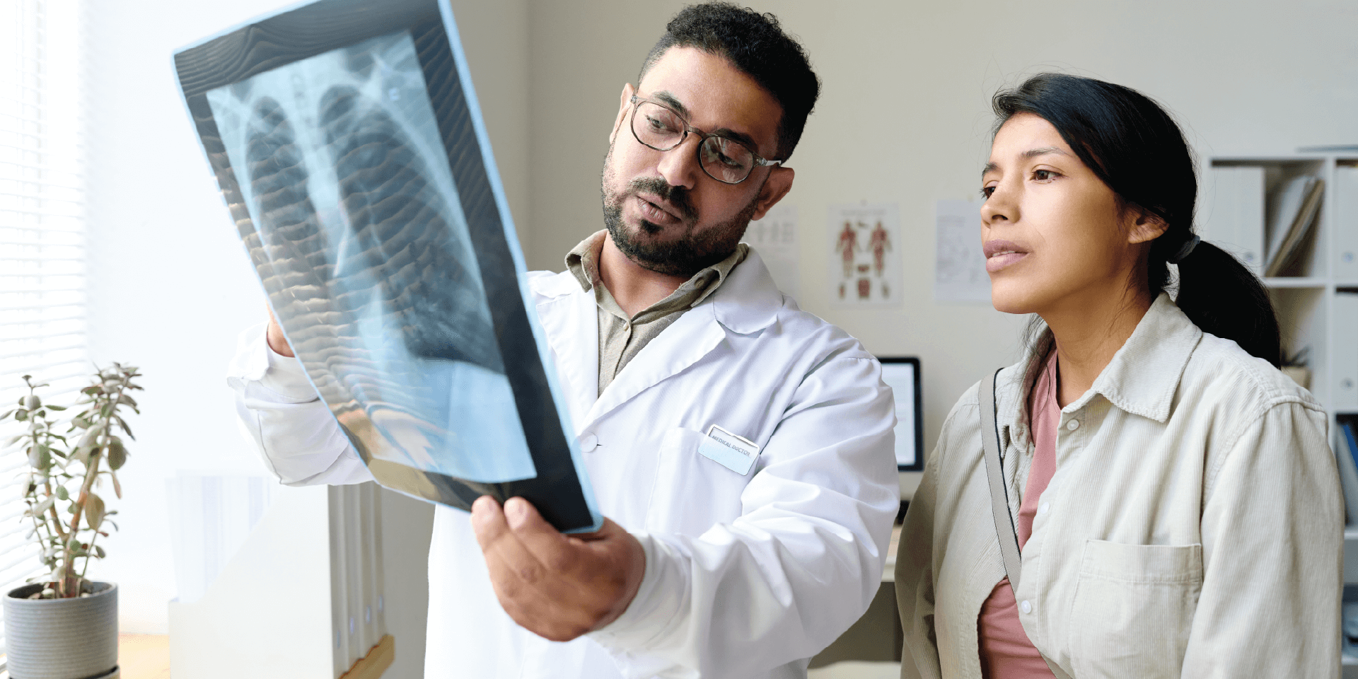 Respiratory therapist showing doctor xray