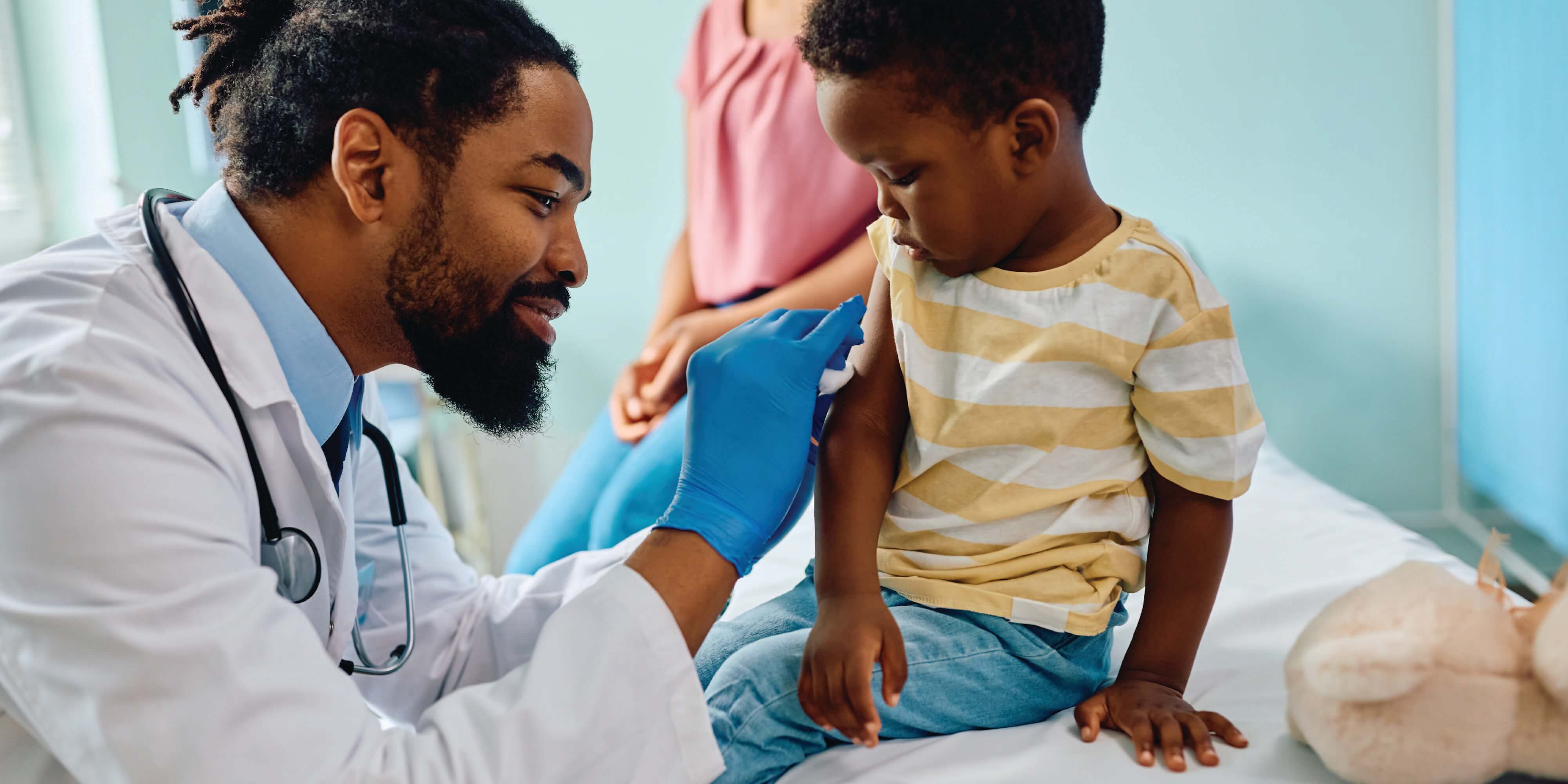Child receiving vaccination in a healthcare setting