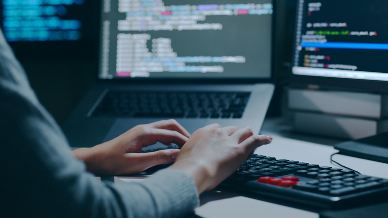 Closeup hand of developer programmer, software engineer, IT support, typing on computer keyboard