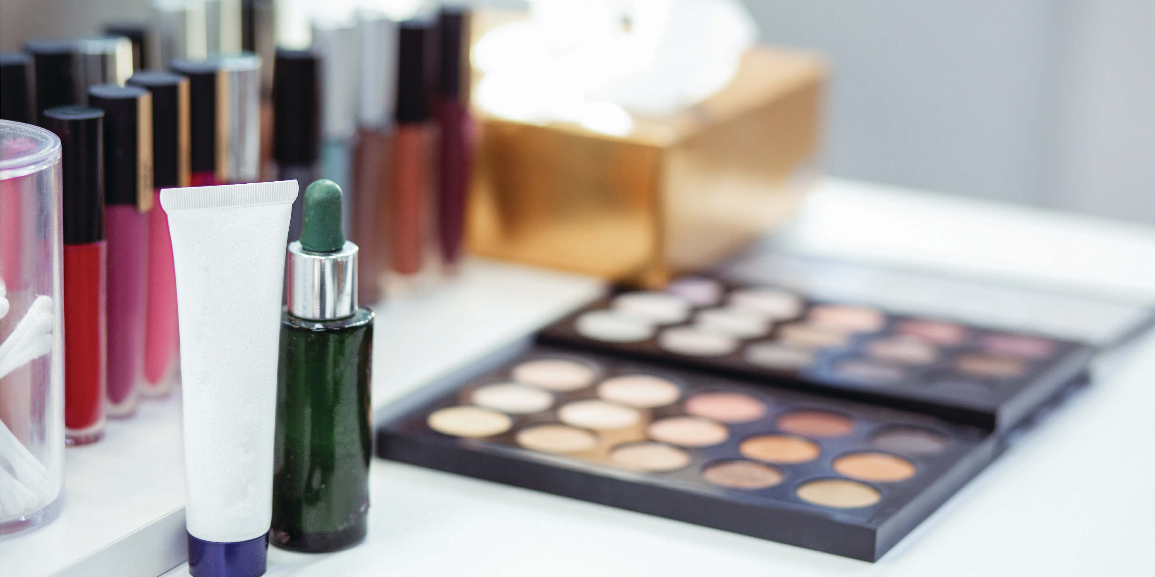 Cosmetics products, including lipstick and eyeshadow pallet.