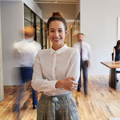 Image of woman wearing business casual attire in an office