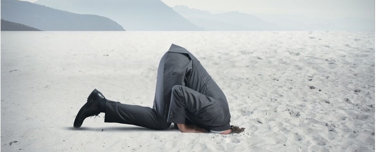 person with head in the sand